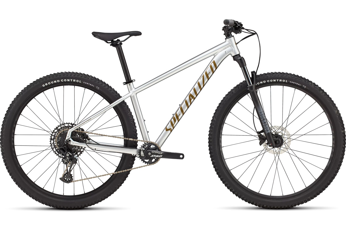 Bicicleta de montaña Specialized Rockhopper Expert 2025, cuadro aluminio A1 Premium, transmisión SRAM NX Eagle 12 velocidades, frenos hidráulicos Shimano, horquilla RockShox Judy SoloAir, ruedas tubeless, ideal para ciclistas en evolución.